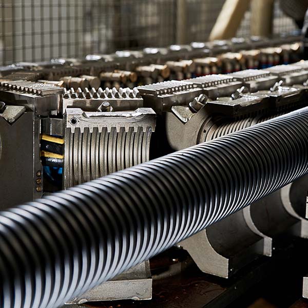Plastic Extrusion Manufacturing Plastic extrusion going through the manufacturing process