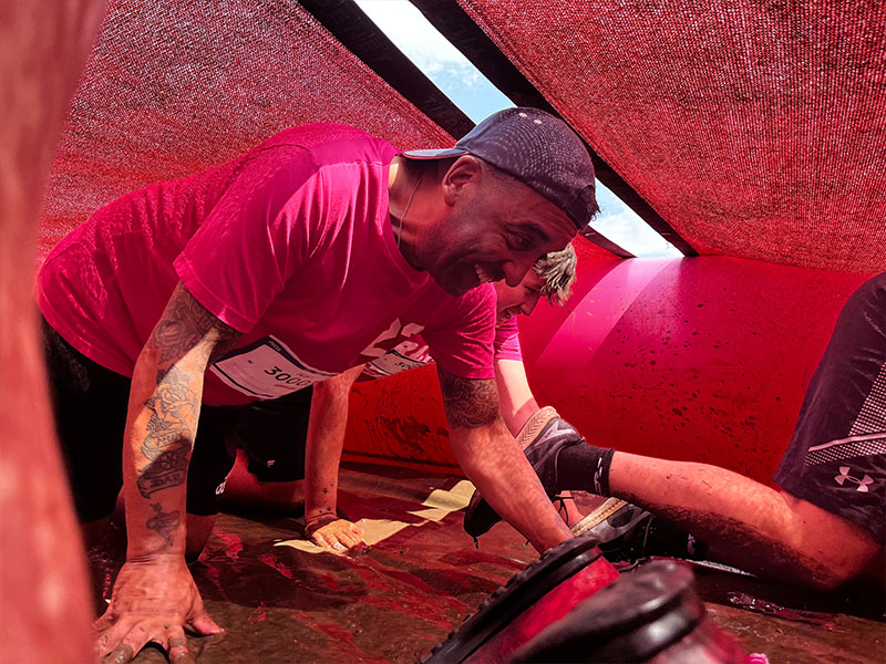 Race for Life 2b ACI Employee in Mud Runner Tunnel