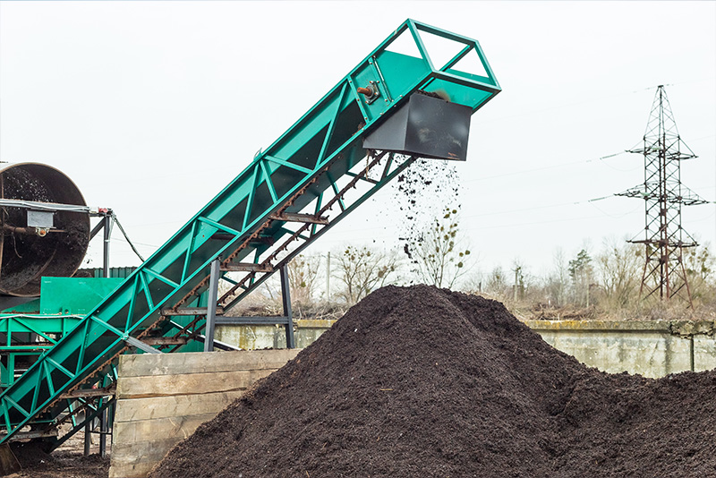 Industrial Compost Aeration Producing soil at industrial compost plant. Sifting soil with a machinery to make clean earth ready to be used