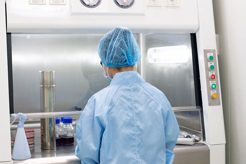Biological Safety Cabinet A laboratory technician working using a biological safety cabinet
