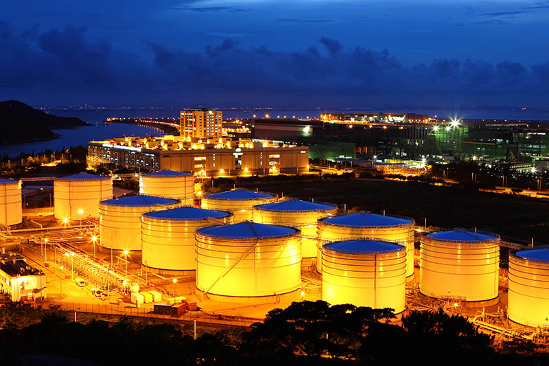 Oil & Gas Refinery Oil refinery illuminated at night