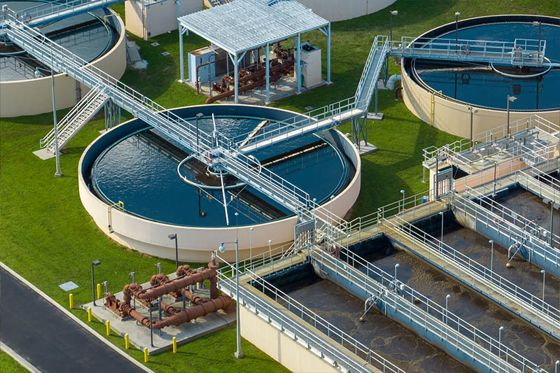 Water Treatment Plant Aerial view of modern water cleaning facility at urban wastewater treatment plant. Purification process of removing undesirable chemicals, suspended solids and gases from contaminated liquid