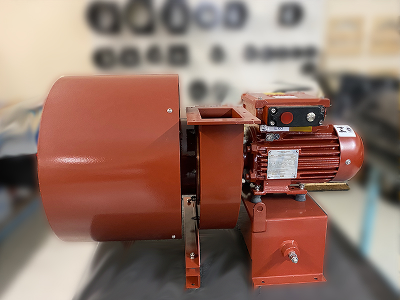 ACI_Image_Custom_Fan_Coating 1 Red epoxy-coated industrial centrifugal fan with ATEX-rated motor, designed for enhanced corrosion resistance in chemically aggressive or hazardous environments.